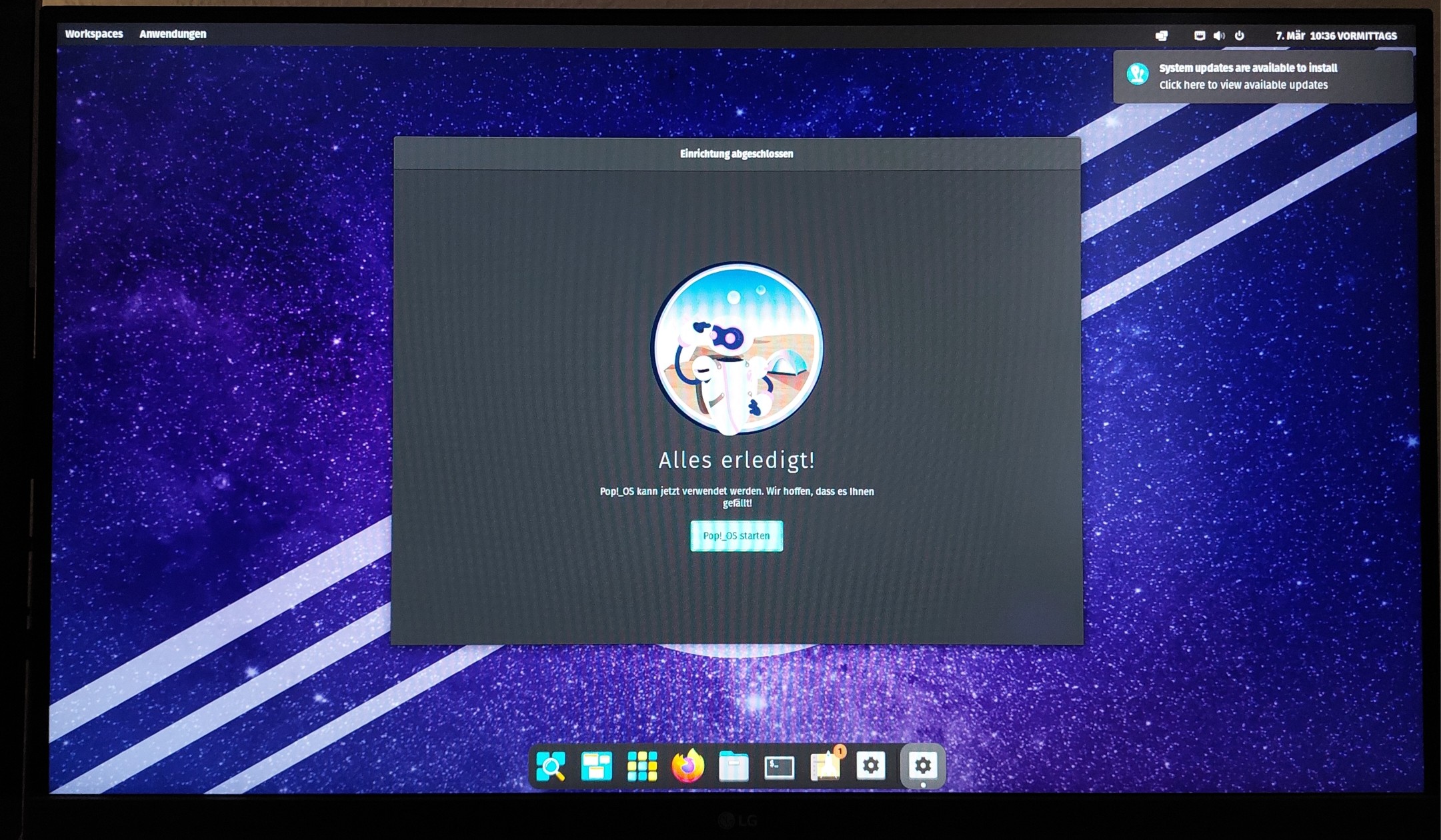 Photo of a Monitor from a PC with the Welcoming Screen after successful installation of Pop_OS.